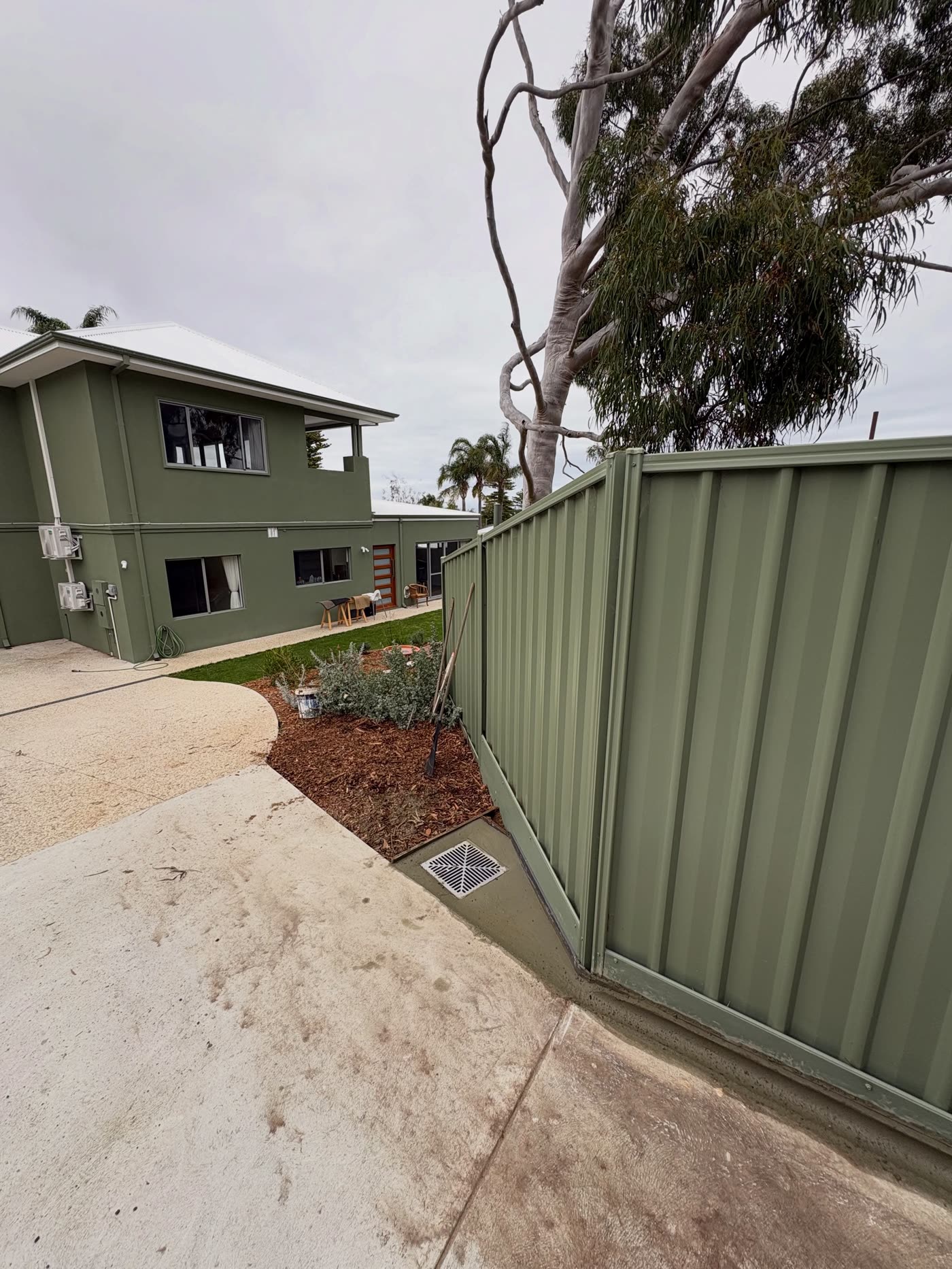 Fremantle emergency Sunday call-out, fresh concrete along the fence and drainage grate