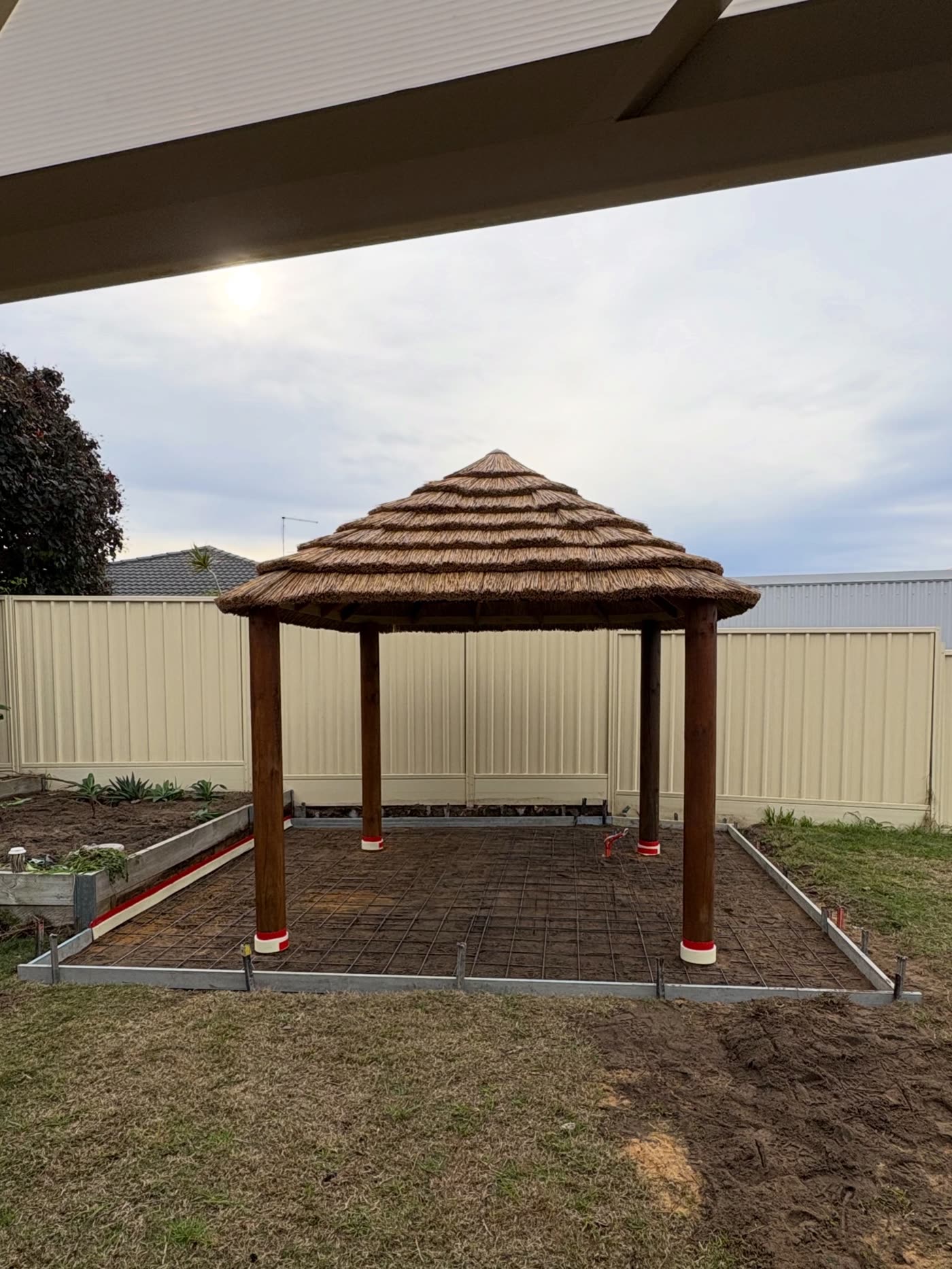 Kinross spa pad before the pour, steel mesh and formwork set out under the gazebo