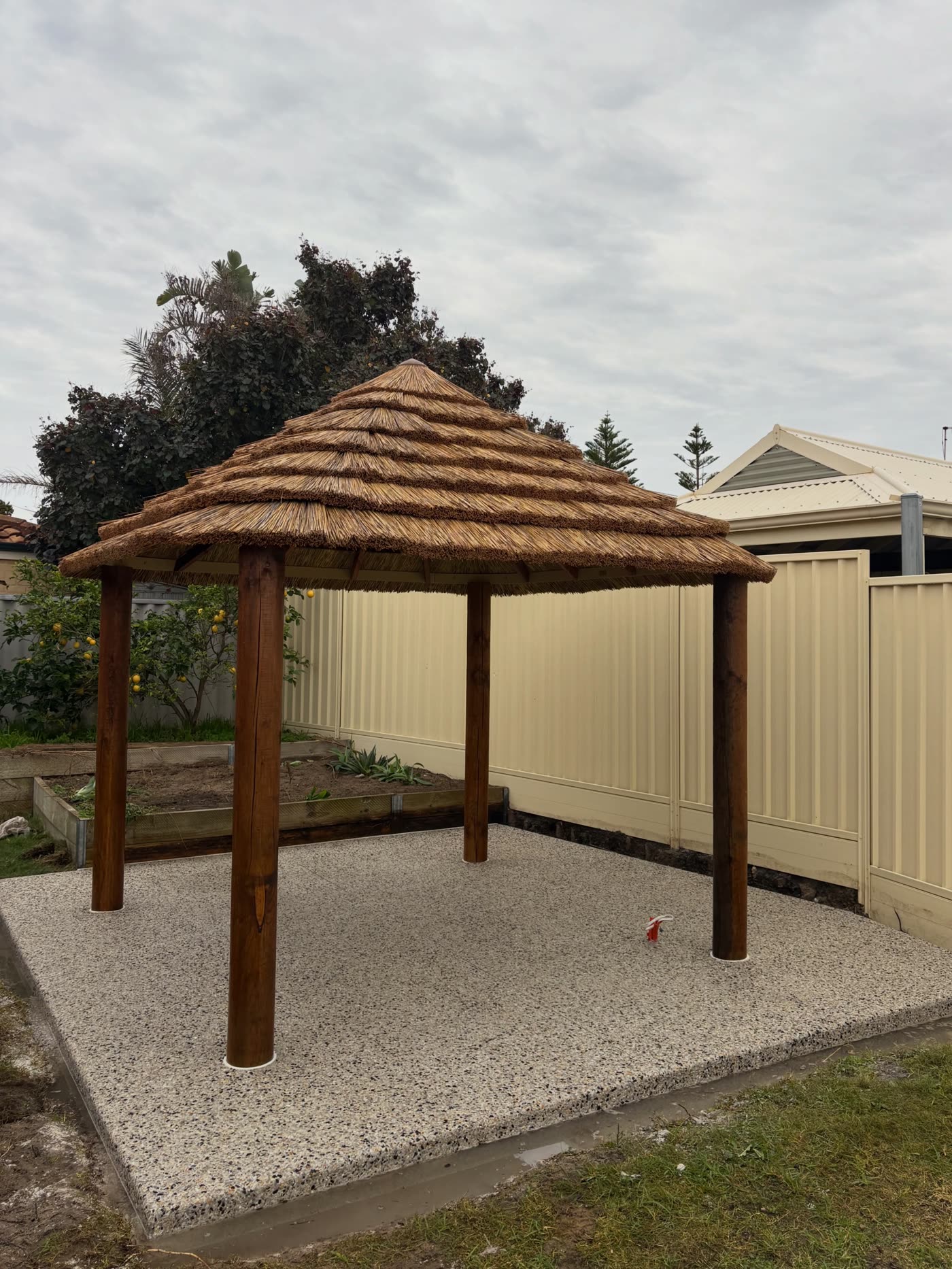 Exposed aggregate spa pad beneath the backyard gazebo, ready for the spa install, Kinross